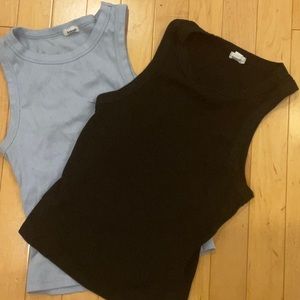 2 garage tanks in colours light blue and black, gently worn.